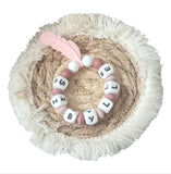 anneau de dentition plume avec prénom personnalisé