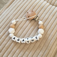attache tétine en silicone et bois blanche 