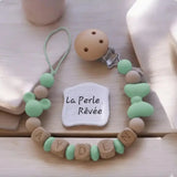 Attache Tétine Personnalisée Minnie |Silicone & Bois Naturel poser à plat sur une table de présentation
