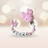 Attache tetine Minnie personnalisée en perles de silicone rose et blanc avec prénom pour bébé.