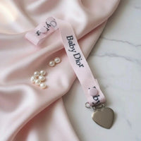 attache tetine en ruban gros grain baby dior