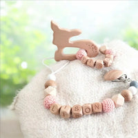 ensemble attache tétine et anneau de dentition en bois et silicone motif biche