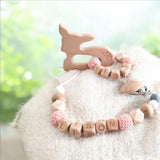 ensemble attache tétine et anneau de dentition en bois et silicone motif biche