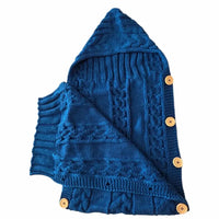 nid ange tricot en laine marine ouvert intérieur 