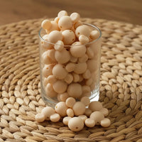 perle en silicone en forme tete mickey en couleur beige creme