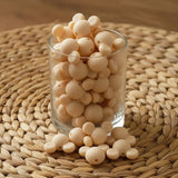 perle en silicone en forme tete mickey en couleur beige creme