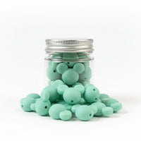 perle en silicone en forme tete mickey en couleur menthe