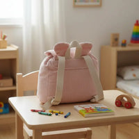 sac a dos maternelle vu de derrière velours côtelé de couleur rose 